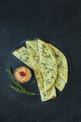 Flatbread with Red Pepper & Goat Cheese spread.