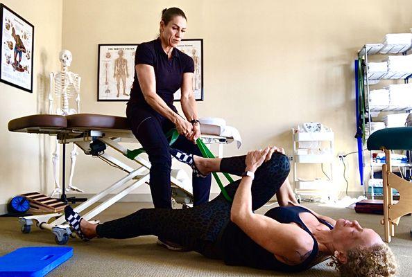 Working on a hip impingement w/my client. A banded distraction to centralize the head of the femur & create space in the joint socket.