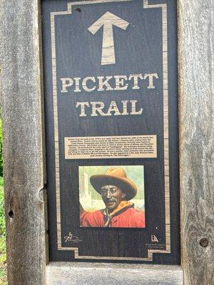 Sign next to paved trail