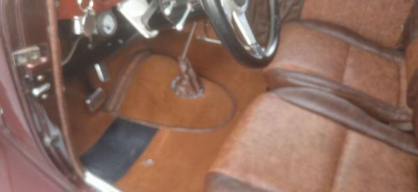 Custom carpet where there was none. Accents of seat matching leather brings the interior together