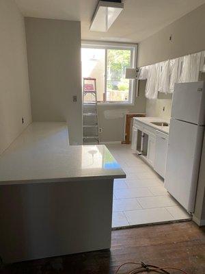 Install kitchen with white counter tops