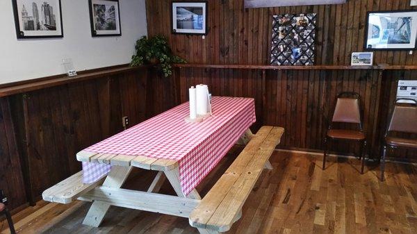 lots of communal picnic tables inside, with sauce and a roll of paper towels instead of napkins