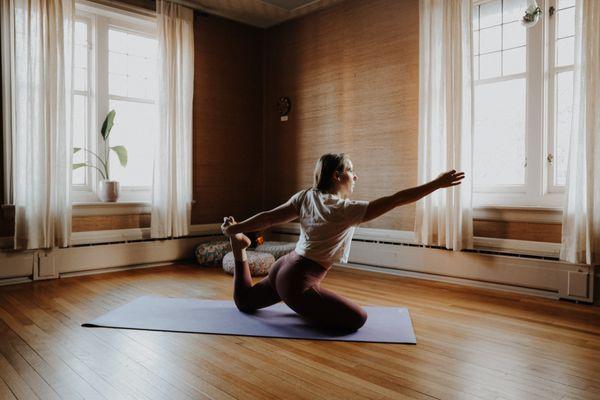 Owner, Rachel, practicing yoga in the Blush Studio (second floor).