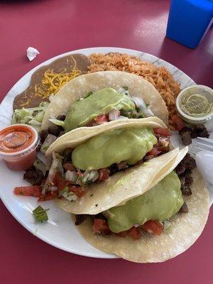 3 Taco asada with rice and beans.