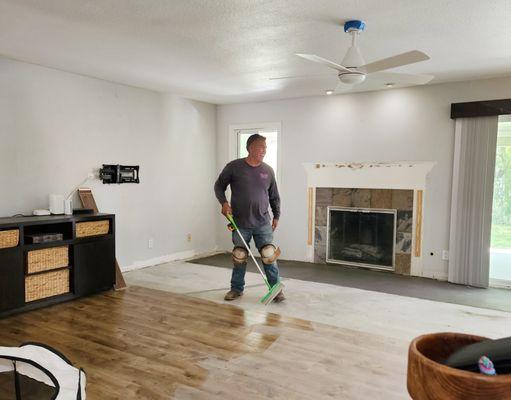 Here is Raul... with that smile!  Cleaning my floor.  Cement work behind him.