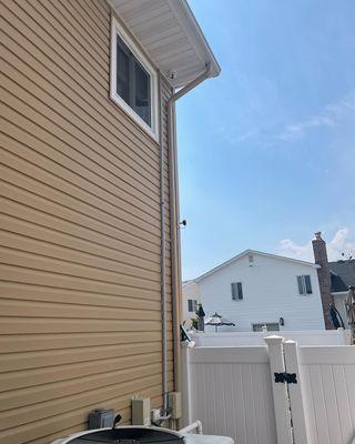 Security camera installation. Security camera mounted on home siding. Turing security cameras , Ip security cameras, 4K security cameras