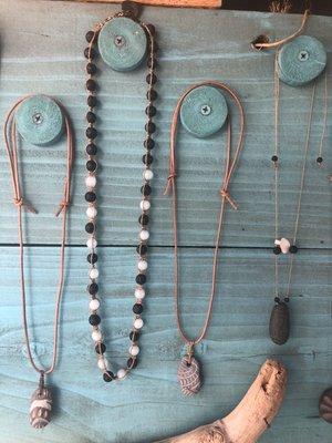 Handmade necklaces, carved stone and macramé