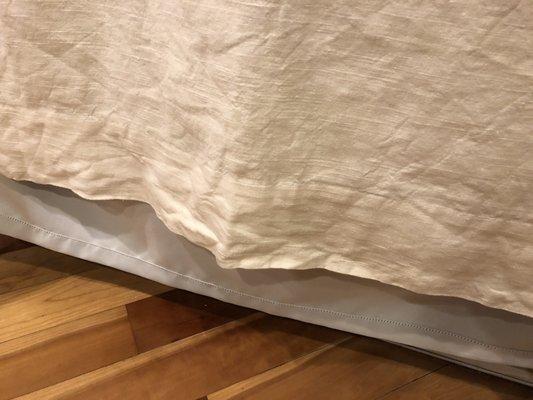 Drapes after being dry cleaned. Wrinkles and drape liner now hanging several inches below the shrunken linen drapes.