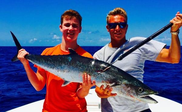 First Mate Austin (right) with a young man who caught his first King Mackerel.