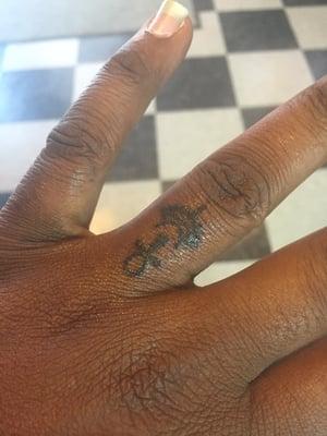 Finger tattoo (Egyptian font) for my wife Ty.