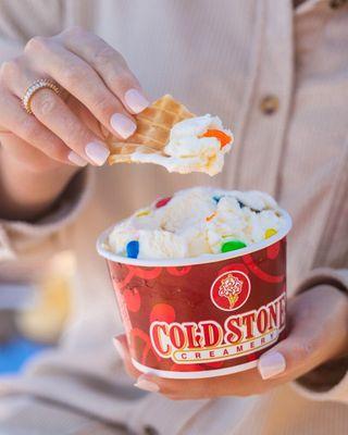 Eating Cold Stone ice cream with a piece of waffle cone as a spoon.