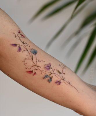 . Floral vine tattoo by Ada