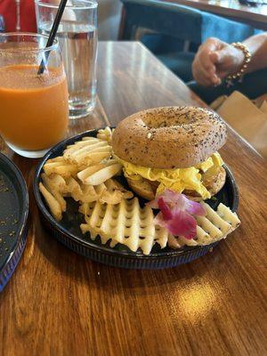 Bagel with bacon egg and potatoes