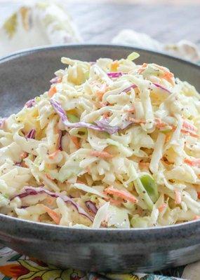 Coleslaw - Our fresh, crisp coleslaw is the perfect balance of tangy and sweet, providing a refreshing sidekick to your smoked meats