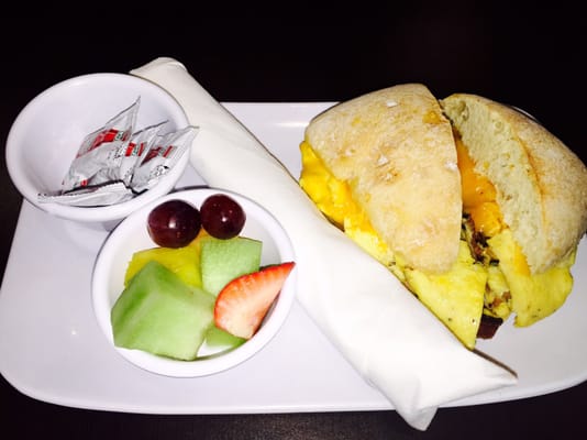 Breakfast sandwich with a side of fruit!