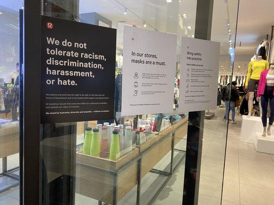 Lululemon's signs as you enter - security greets you as you walk in, and maintains safety of the store