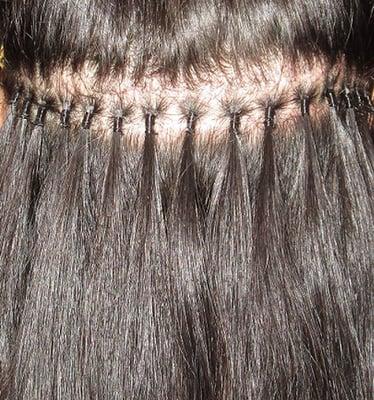 A small section of your hair is connected with a small portion of hair extension and together they are connected by an elastic thread.