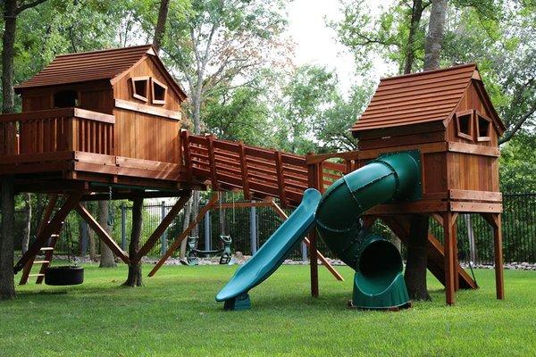 Ticonderoga playset bridged to Fun Shack and bridged to tree deck with swing beam.