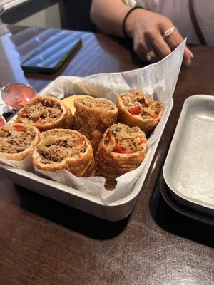 Steak and cheese egg rolls