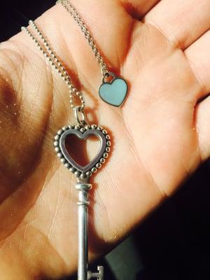 See the Tiffany heart key pendant necklace . Damage no turquoise blue around heart. This is how it was returned to me .