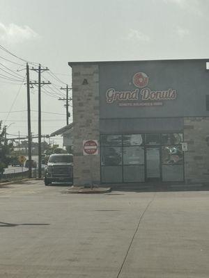 View of Grand Donuts from the parking lot.