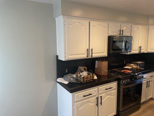 Painting of kitchen cabinets and walls