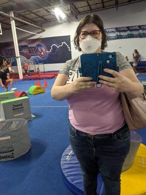 Selfie in a mirror of the gym wall