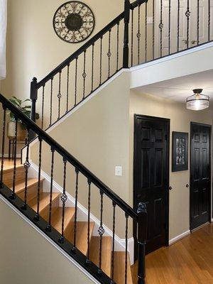 Builder grade to custom stairway including paint and iron installation