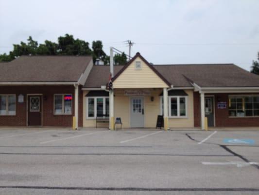 Storefront Shot, in the back of the center on the left.