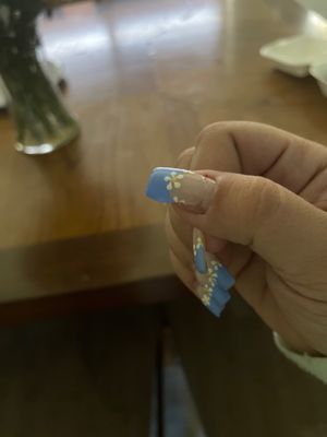 A broken nail only after a week and poorly designed flowers