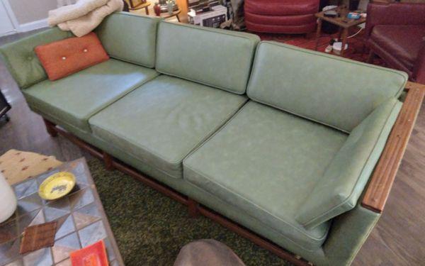 MCM Ranch Oak sofa reupholstered in period correct, sturdy, pet resistant moss green vinyl. Looks like leather. Gorgeous.