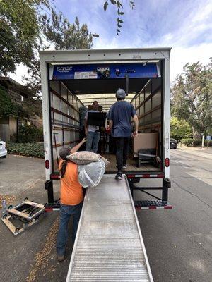 The team loading the truck.