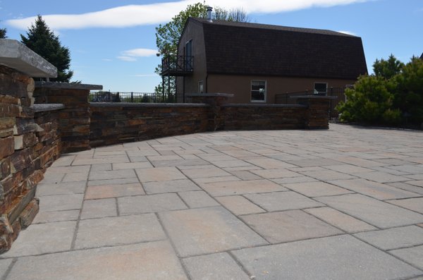 Sitting Wall, featuring natural stone facing with blue stone capping.