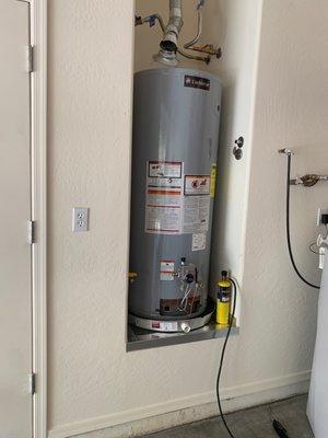 Drywall fixed and water heater ready to be plugged back again.