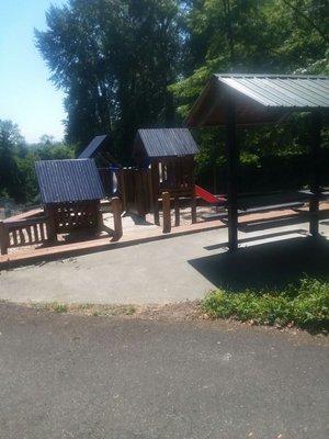 A great tiny playground for the 1-3 range depending on tot's mobility, too. Steps aren't steep. Small enough to see from the bench.