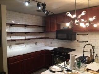 White subway tile backsplash and open shelves