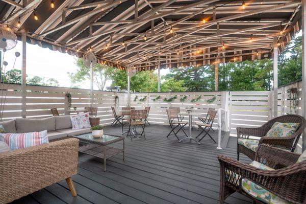 The covered porch is a great place for you and your friends to gather with a bottle of wine.