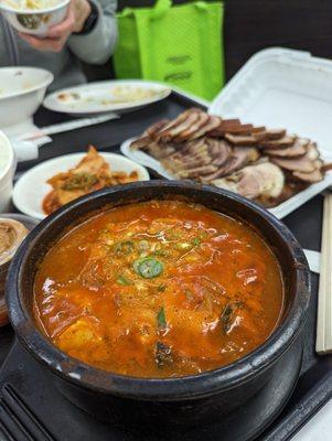 #15 ttukbaegi gopchang (beef small intestine soup) with small jokbal in the back