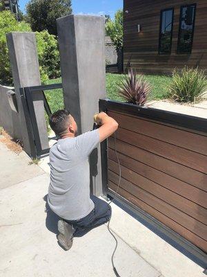 Gate and fence with metal frame and Wood New motor installation intercom system in Sherman Oaks 91401