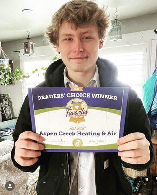 Charlie proudly holds our, "Best of Broomfield" award from Our Broomfield Magazine