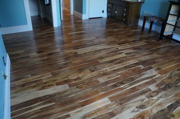 Upstairs floor install by Woodcraft. Natural pre-finished acacia.