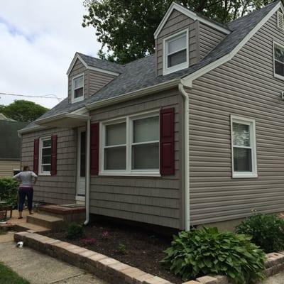 After: The roof was enhanced with dimensional shingles and a new gutter system was added.