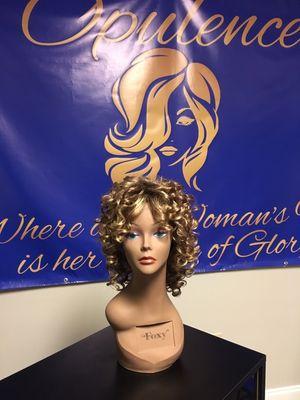 This mid-length wig with impeccable temple to temple lace front that offers styling versatility and seamless, natural hairline