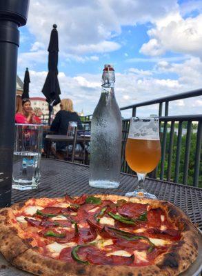 Pizza with dry cured Spanish chorizo, mozzarella, poblano, tomato, garlic, and slightly spicy honey