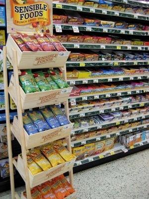 A rack of Sensible Foods Crunch Dried Snacks in Grocery Store