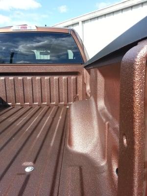 Ford Bronze Metallic Color Code in LINE-X Xtra.