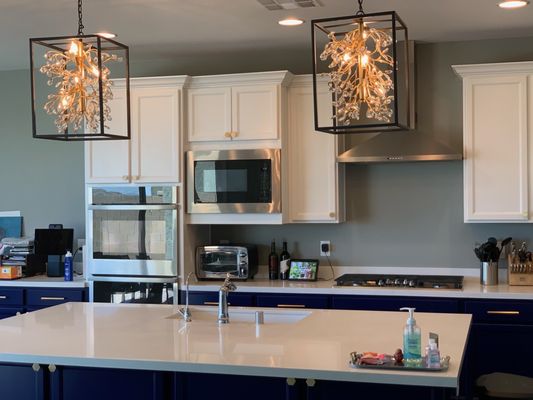 White upper and blue lower cabinets.