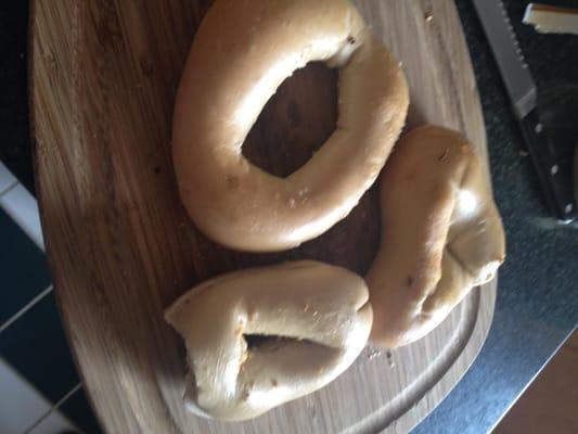 3 plain bagels, inconsistent in appearance