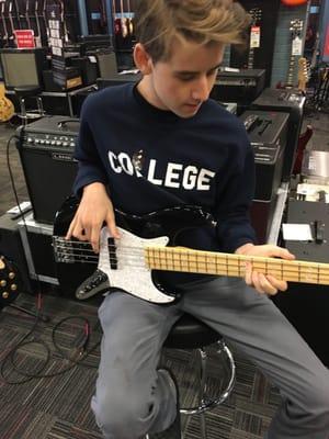 The boy playing the Geddy Lee Fender