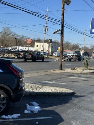 Car carriers blocking traffic and causing a dangerous situation on Olden Ave